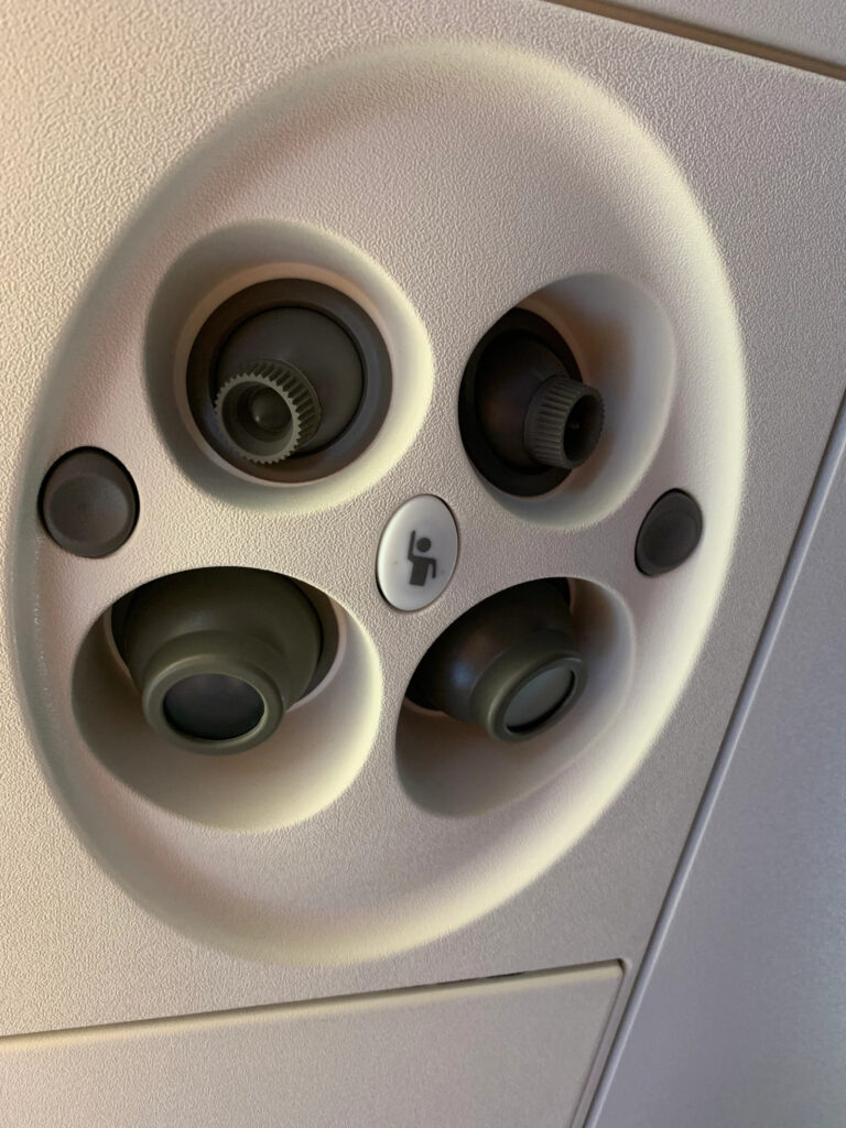 The thing above your seat in an airplane where you can direct air or light at yourself or call the attendant 
