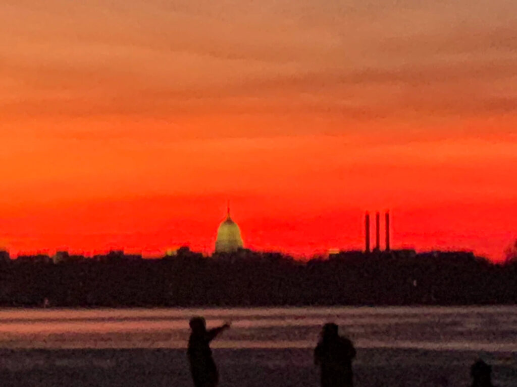A view of Wisconsin's state capitol in Madison against a very red sunset