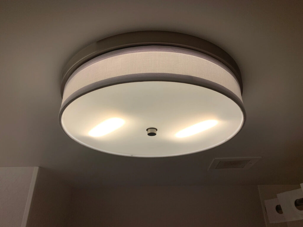 A short but wide cylindrical ceiling lamp