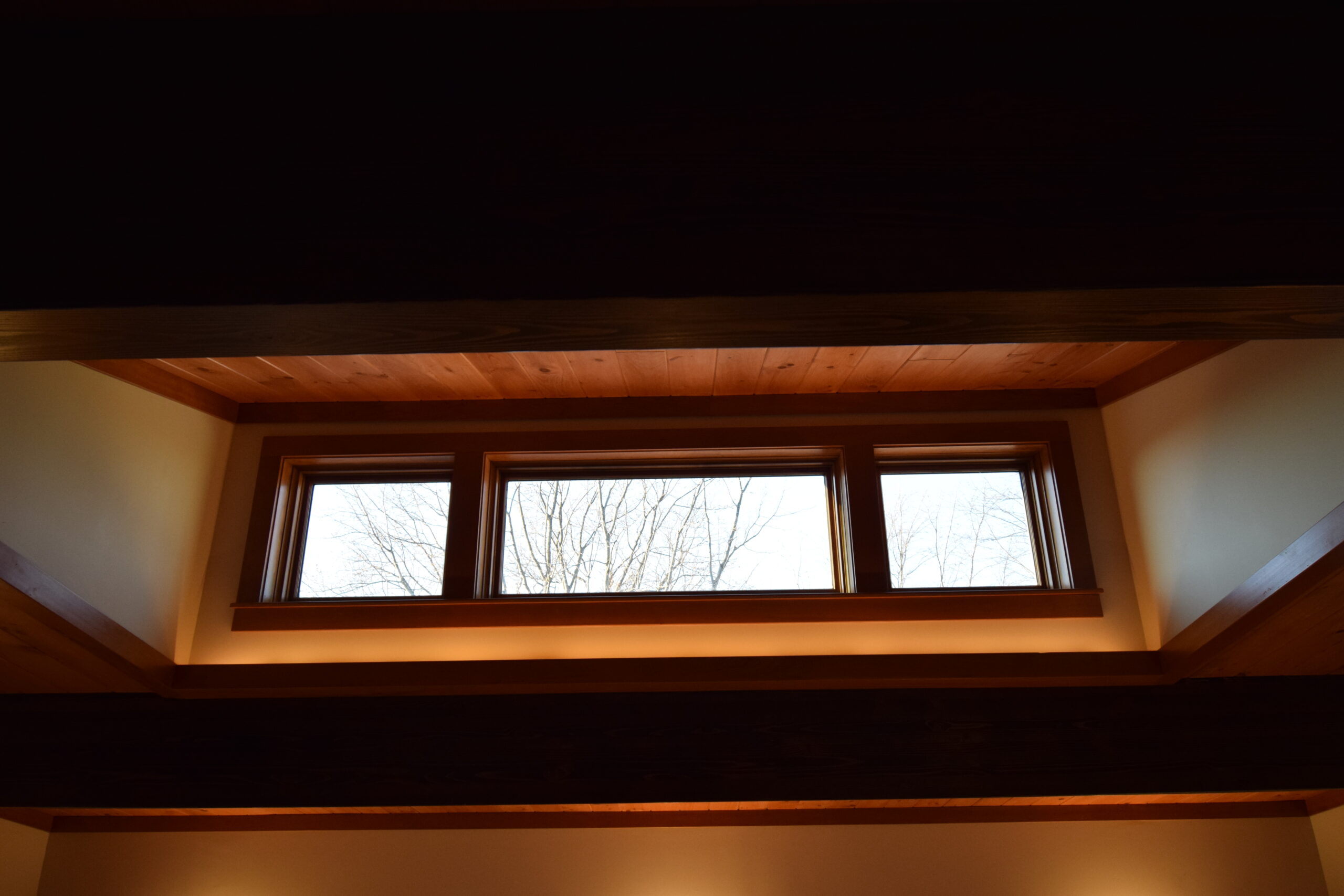 A photograph of a skylight next to a ceiling